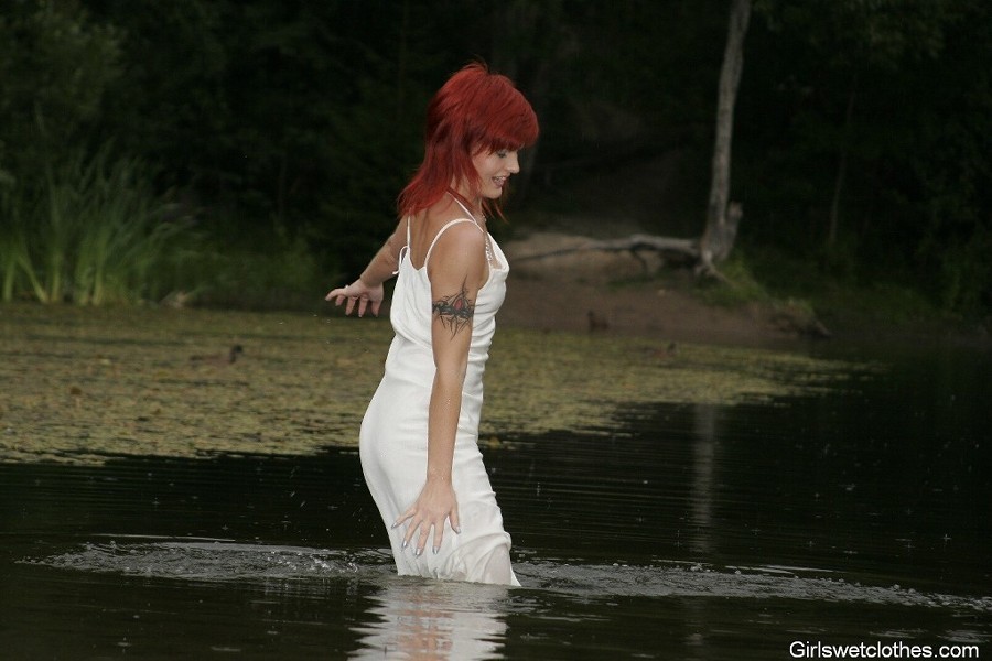 Sexy redhead in a wet evening dress #76650465