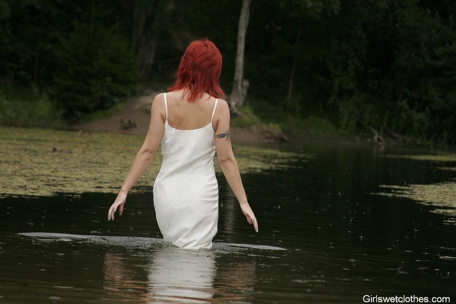 Sexy redhead in a wet evening dress #76650484