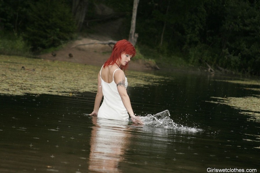 Sexy redhead in a wet evening dress #76650508