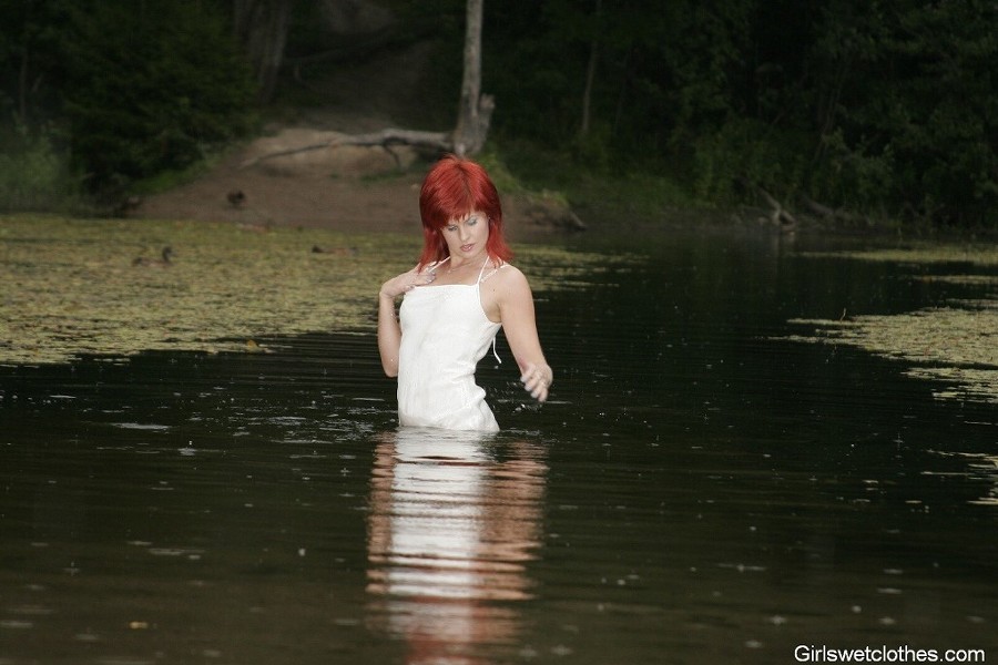 Sexy redhead in a wet evening dress #76650517