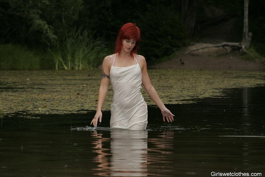 Sexy redhead in a wet evening dress #76650531