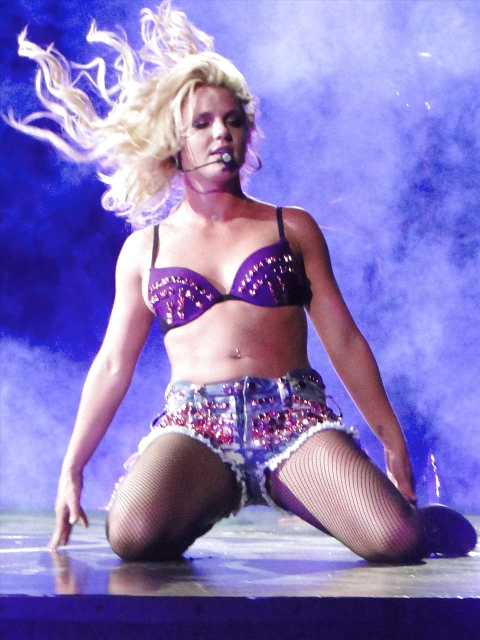 Britney Spears in fishnets and shorts spreading her legs on stage #75299163