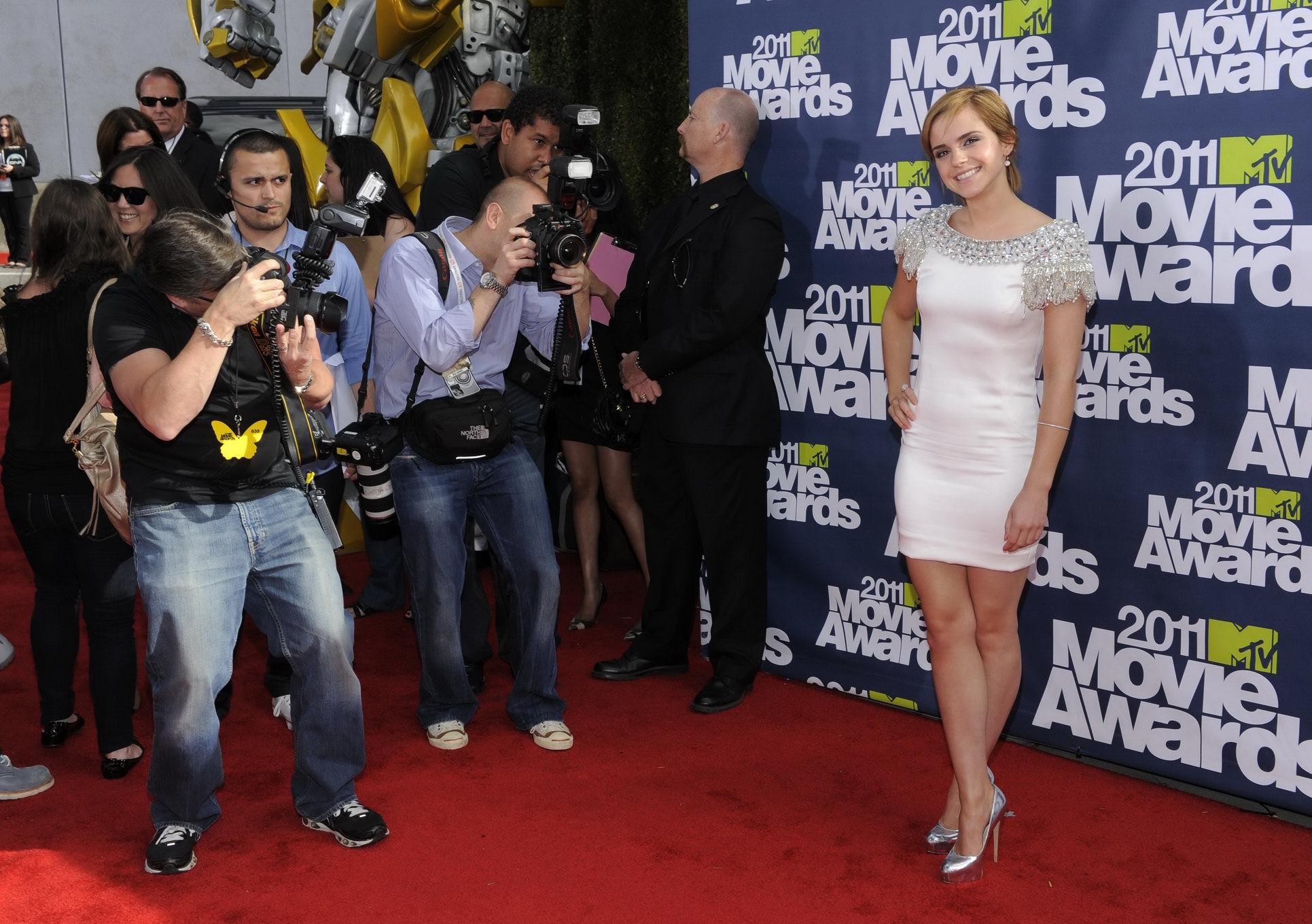 Emma Watson leggy  showing ass in mini dress at The MTV 2011 Movie Awards #75300846