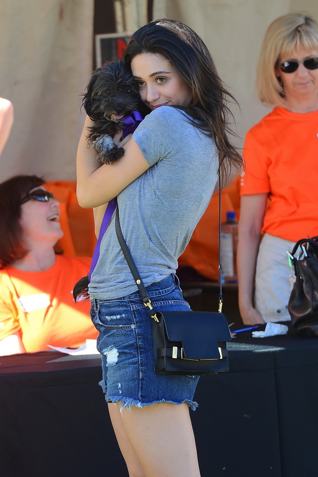 Emmy Rossum busty and leggy wearing denim shorts and top at the NKLA Adoption Ev #75181136