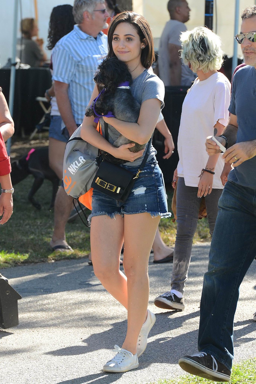 Emmy Rossum busty and leggy wearing denim shorts and top at the NKLA Adoption Ev #75181217