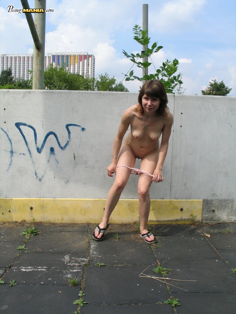 Impudent naked chickie does a piss and shows off in a public place #76565805