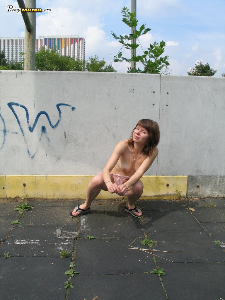 Impudent naked chickie does a piss and shows off in a public place #76565812