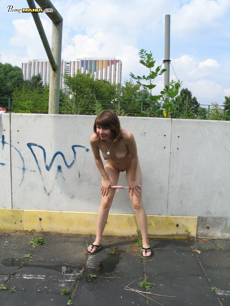 Impudent naked chickie does a piss and shows off in a public place #76565897