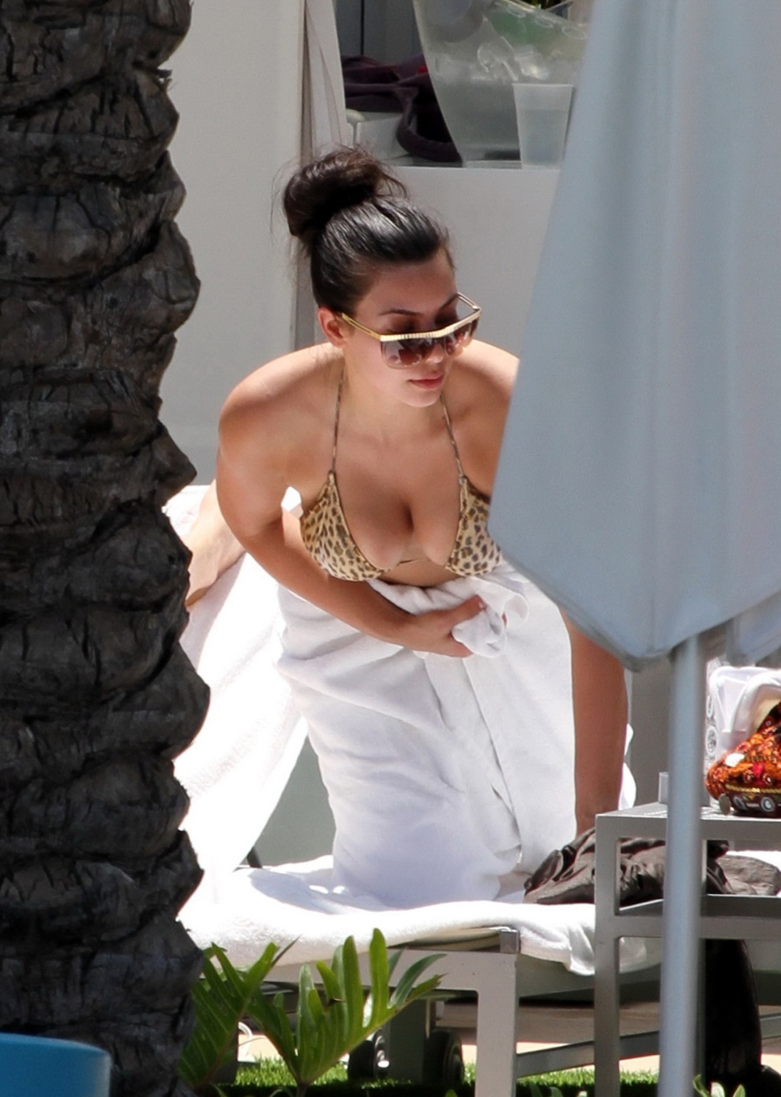 Kim Kardashian busty wearing leopard print bikini poolside in Miami #75345063
