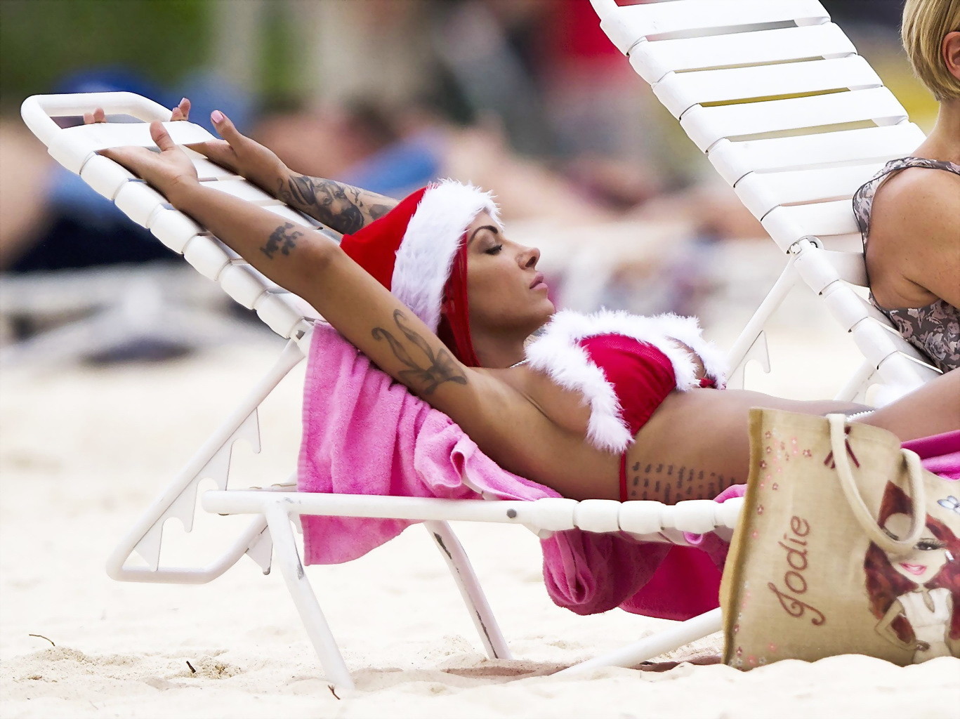 Jodie Marsh shows off her curvy body in Santa bikini at the beach in Barbados