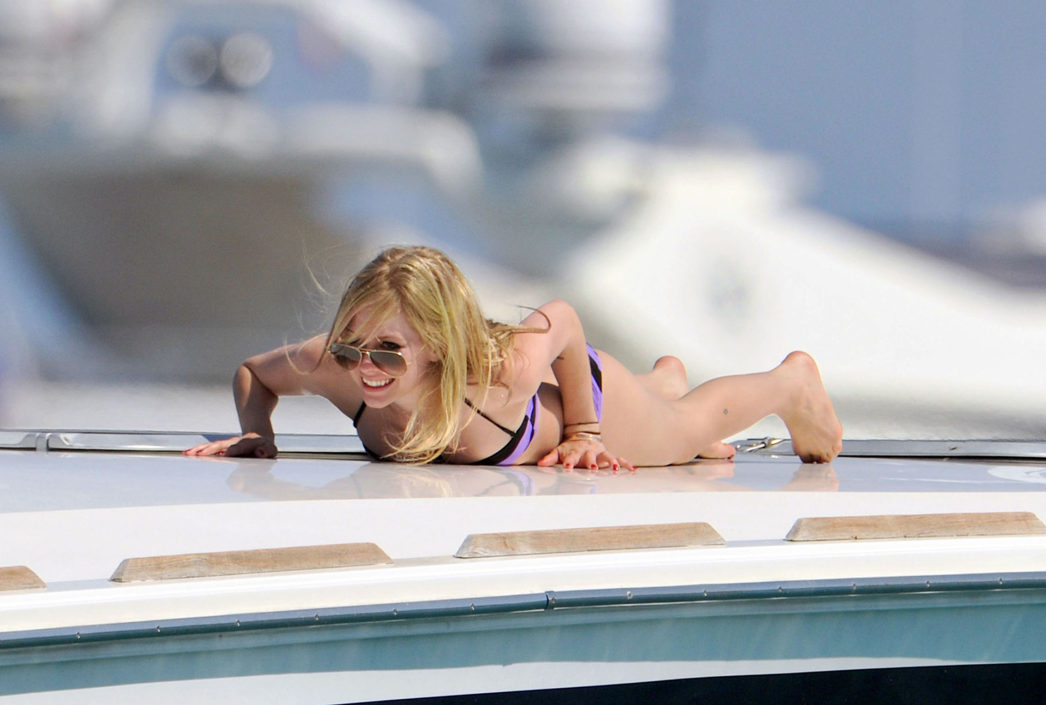 Avril Lavigne showing off her bikini body on a yacht in Saint Tropez