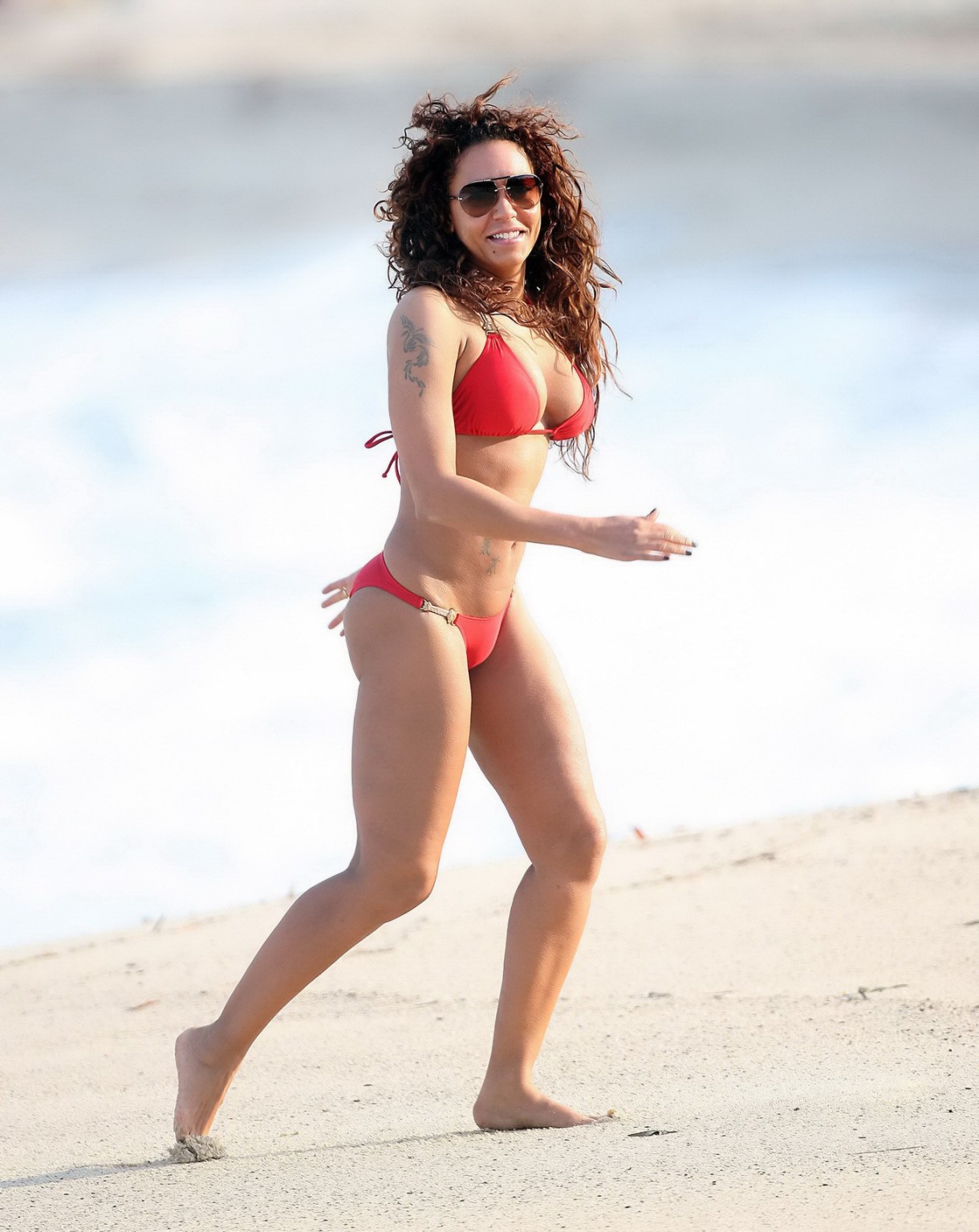 Melanie Brown wearing skimpy red bikini at Bronte Beach in Sydney #75214960