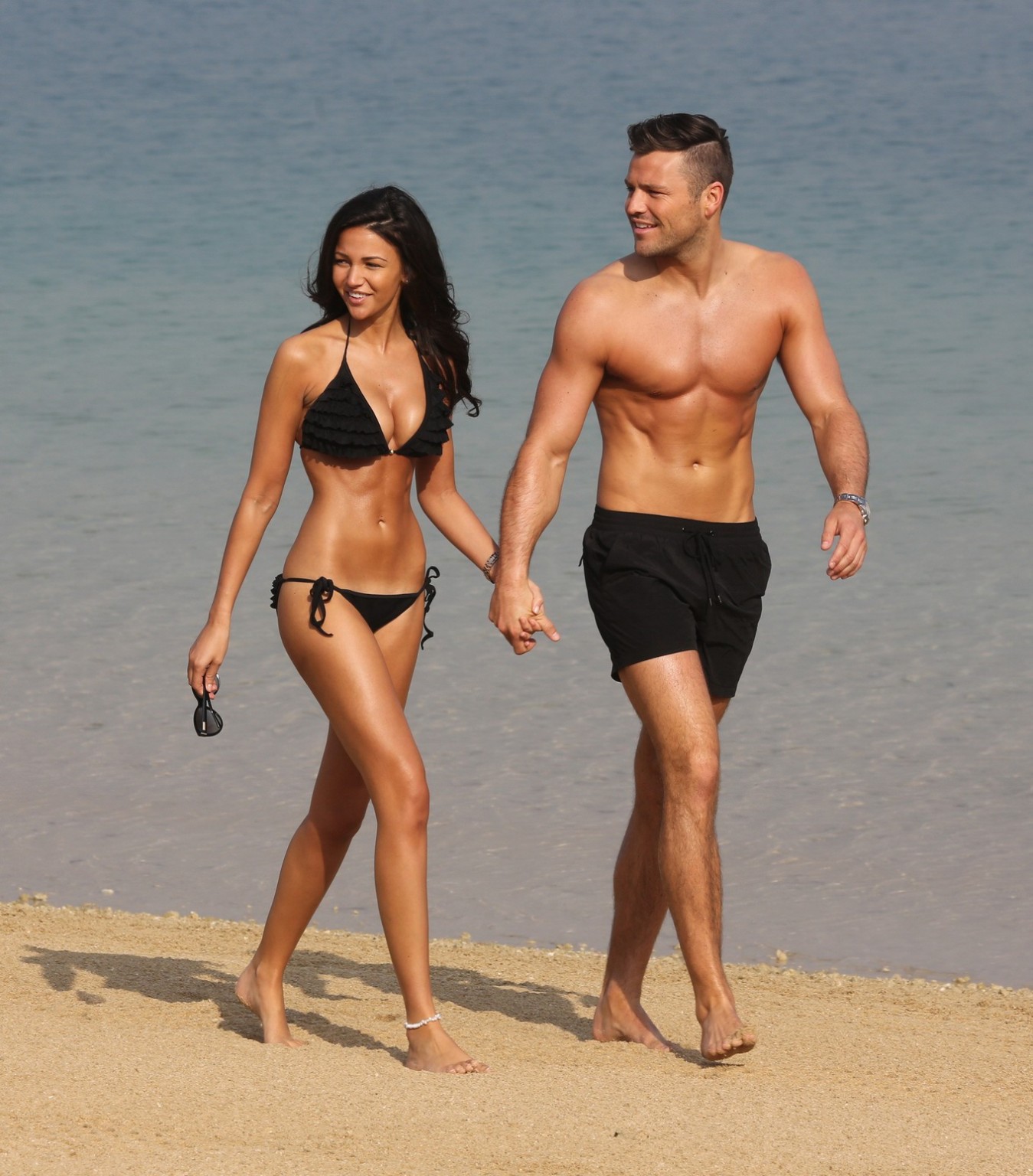 Michelle Keegan busty in a tiny black bikini at the beach #75199983