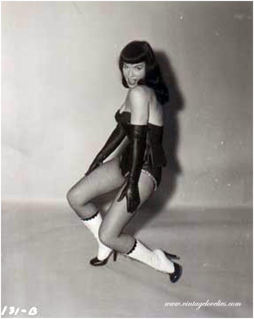 Pin-up star Bettie Page showing her sexy vintage stockings #76521494