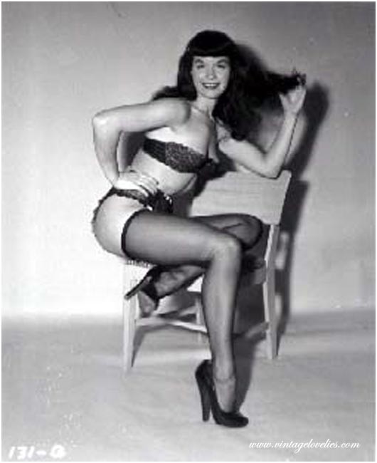 Pin-up star Bettie Page showing her sexy vintage stockings #76521521