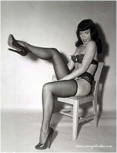 Pin-up star Bettie Page showing her sexy vintage stockings #76521535