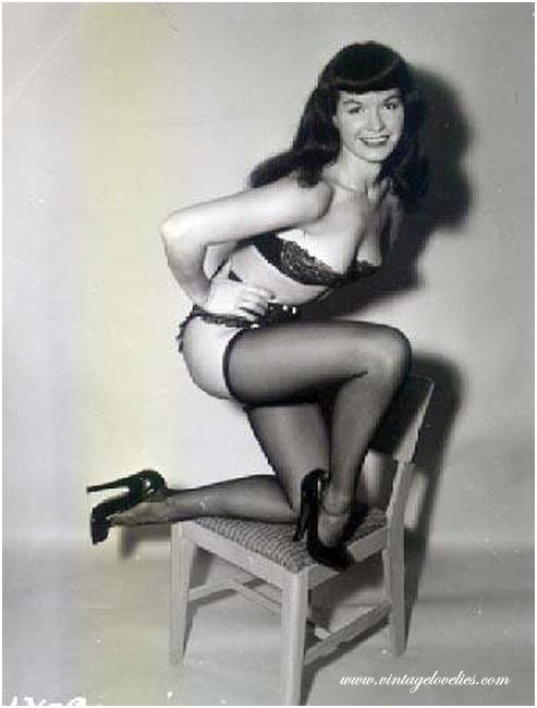 Pin-up star Bettie Page showing her sexy vintage stockings #76521539