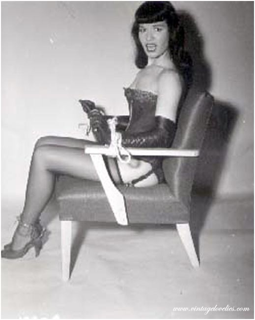 Pin-up star Bettie Page showing her sexy vintage stockings #76521546