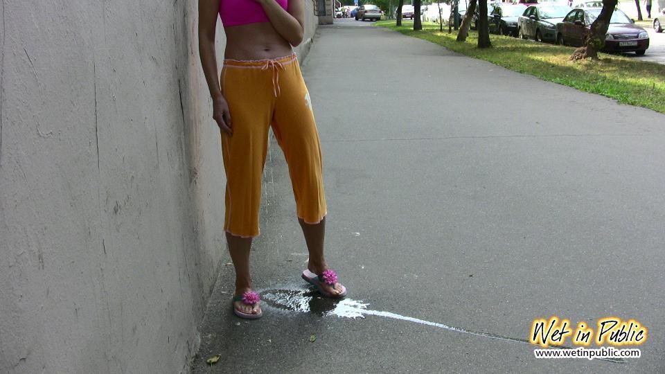 Blonde in sporty breeches and top shockingly wets herself on the street #73238626