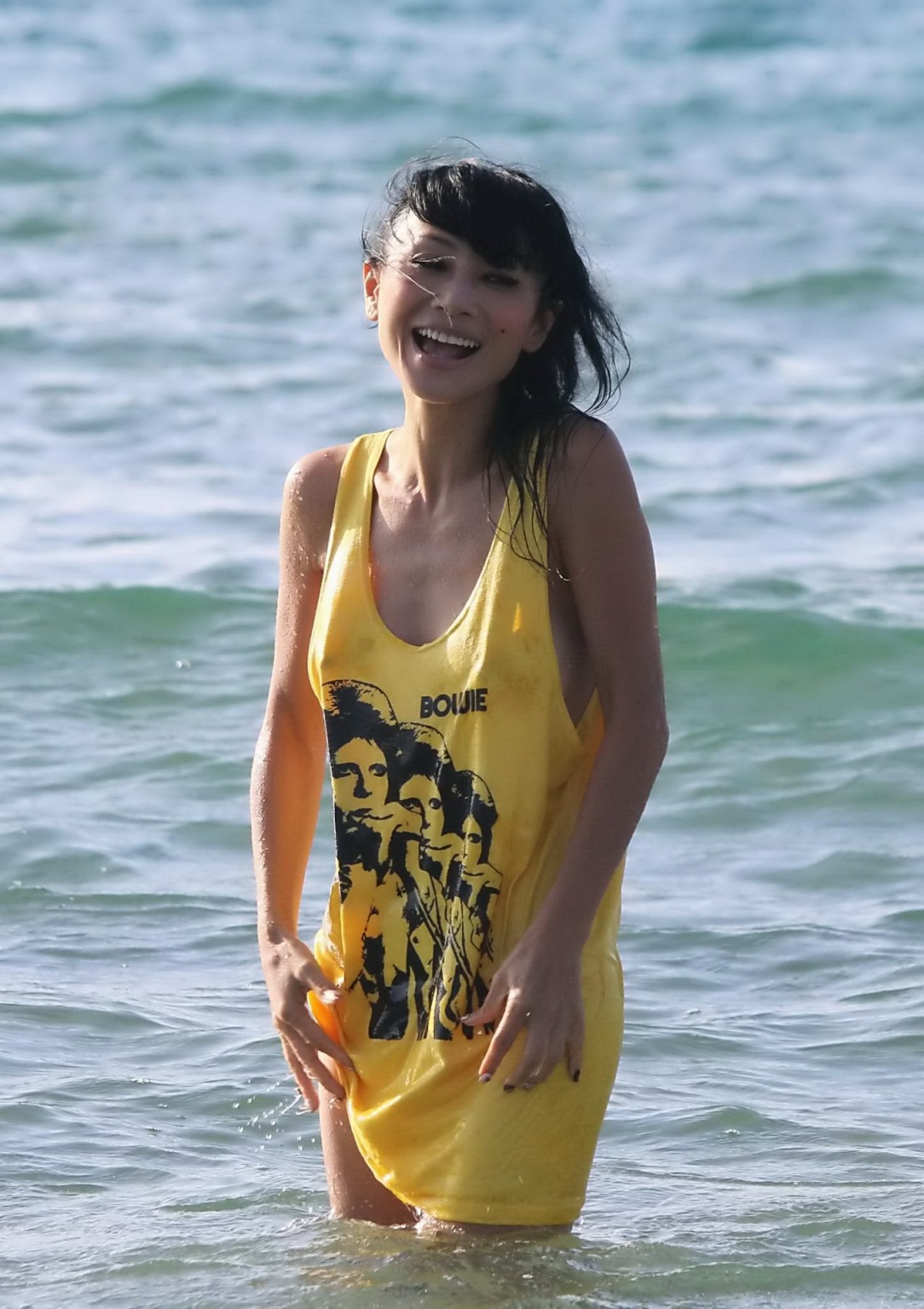 Bai Ling shows sideboob and pokies in wet tshirt and bikini bottom at the beach  #75179106