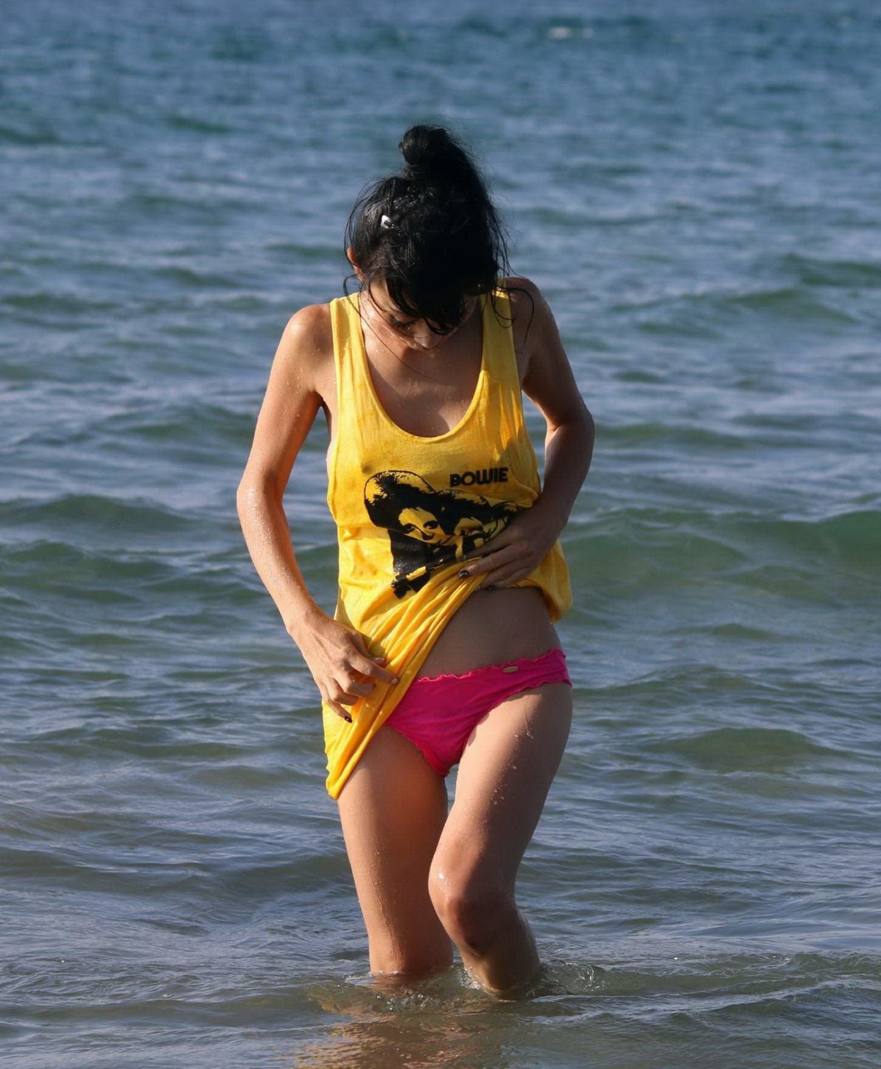Bai Ling shows sideboob and pokies in wet tshirt and bikini bottom at the beach  #75179128