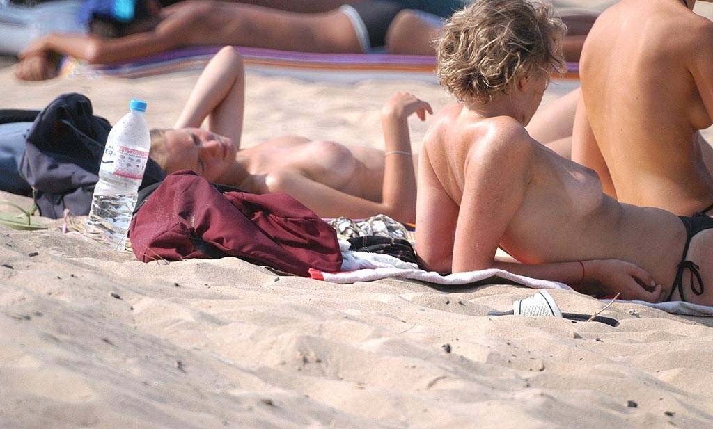 Two nudist mates get an even tan at the beach #72252442
