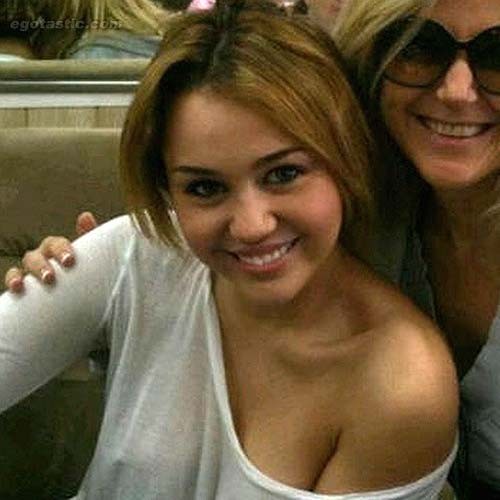 Miley Cyrus exposing her tattoo and boobs in see thru #75261345
