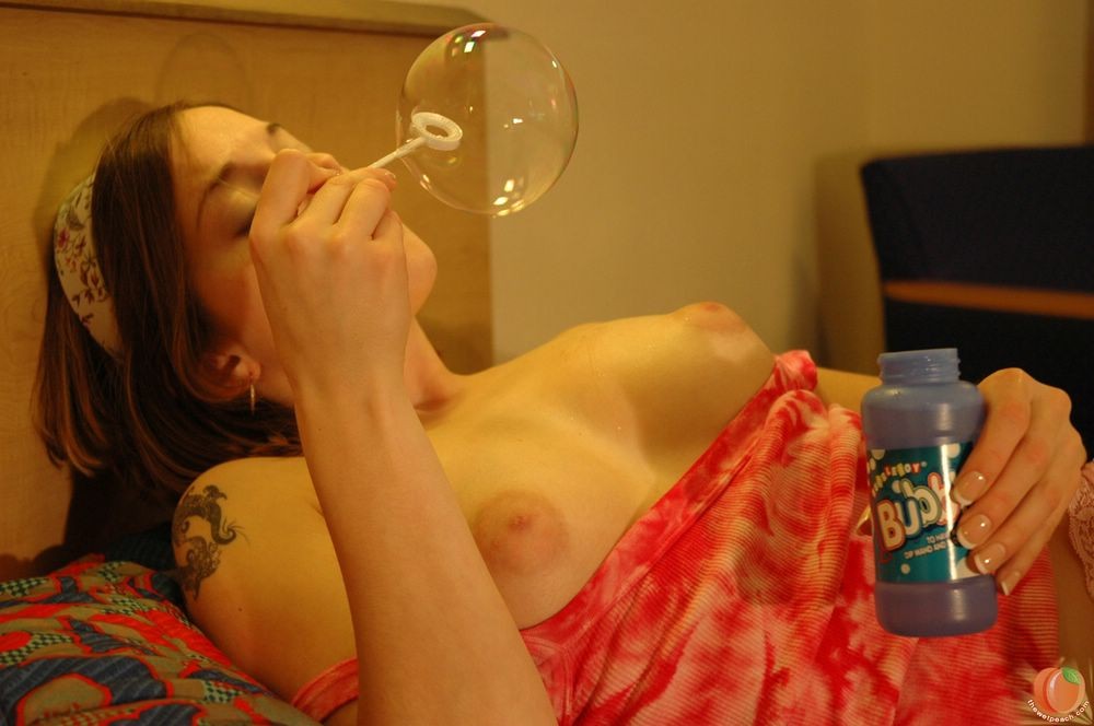 Teen strips out of pajamas and blows bubbles on her big titties #71137075