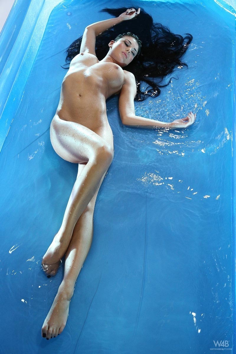 Busty wet brunette in a pool #70745525