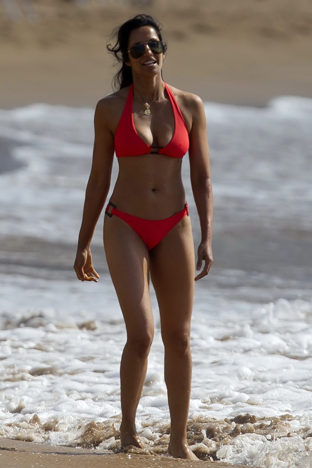 Padma Lakshmi wearing a sexy red bikini on a beach in Hawaii #75216463