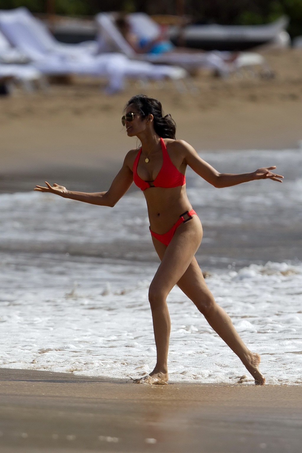 Padma Lakshmi wearing a sexy red bikini on a beach in Hawaii #75216513