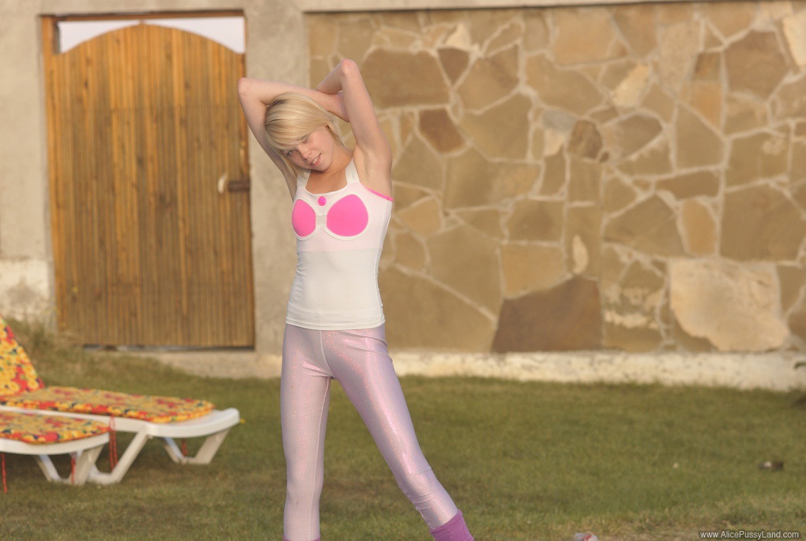 Young teen beauty exercising by the pool #73808262