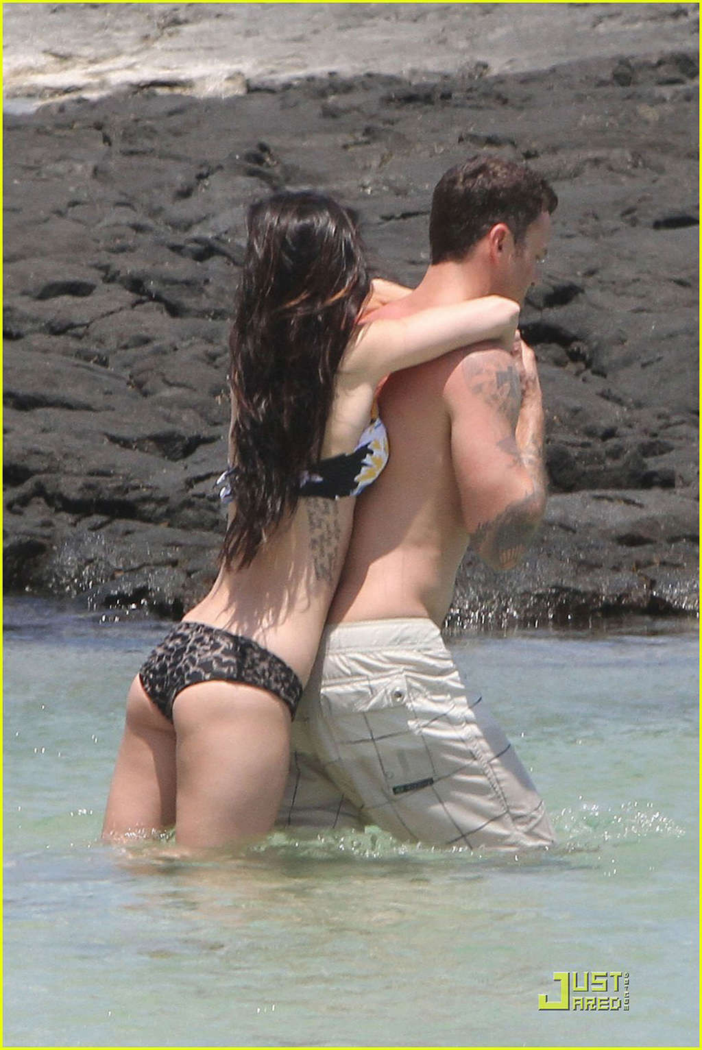 Megan Fox in bikini playing on beach with her boyfriend #75343179