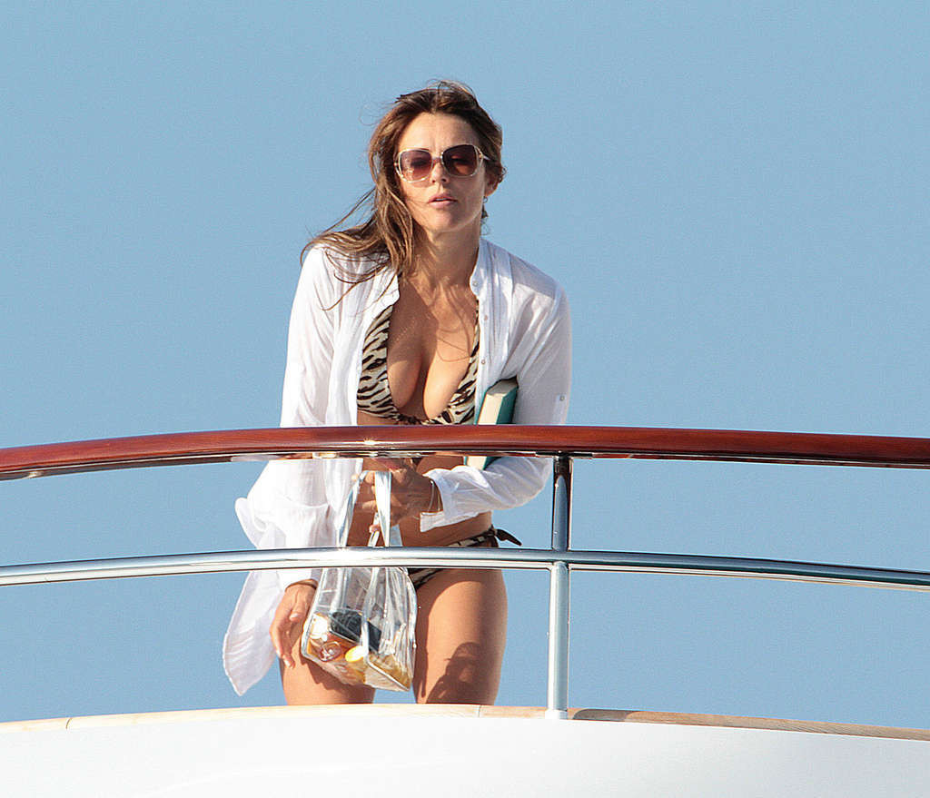 Elizabeth Hurley exposing her sexy body and huge boobs in bikini on yacht #75338113