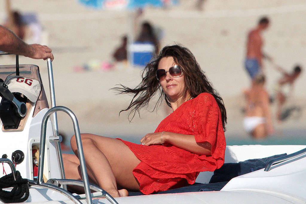 Elizabeth Hurley exposing her sexy body and huge boobs in bikini on yacht #75338127