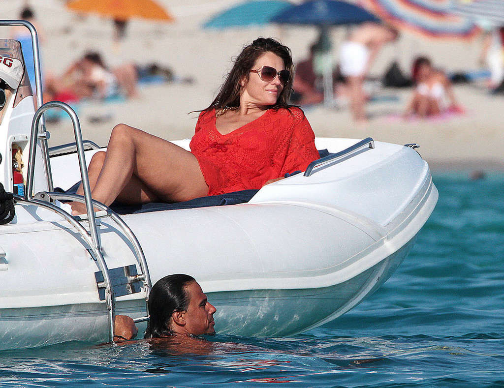 Elizabeth Hurley exposing her sexy body and huge boobs in bikini on yacht #75338144