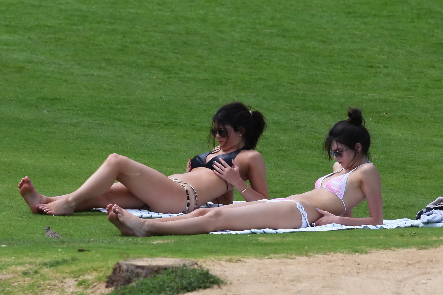 Kylie and Kendall Jenner tanning their hot bodies in skimpy bikini sets on a mea #75174050