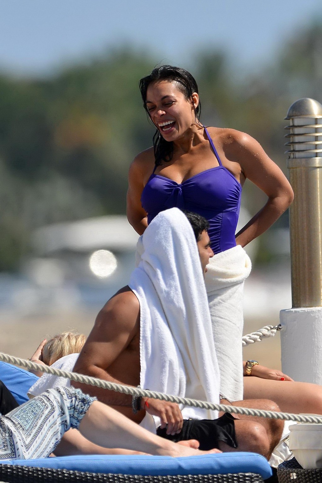 Rosario Dawson shows off her chubby body wearing a purple swimsuit  on the pier  #75193520
