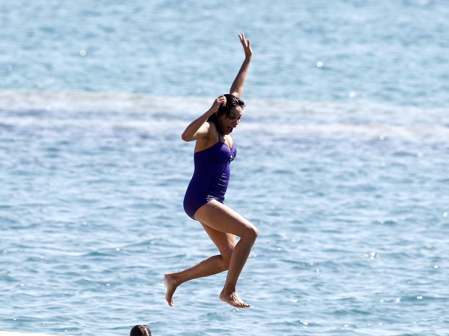 Rosario Dawson shows off her chubby body wearing a purple swimsuit  on the pier  #75193524