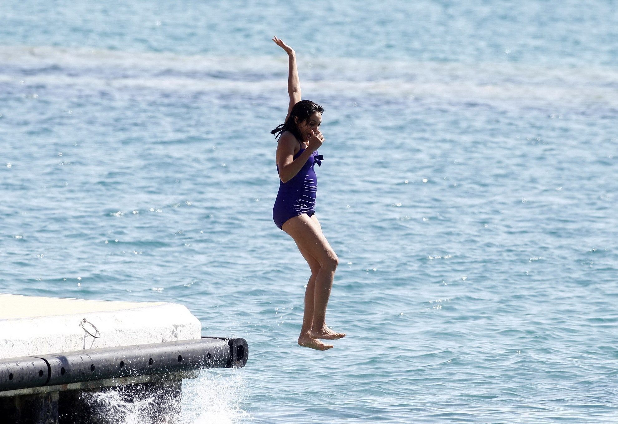 Rosario Dawson shows off her chubby body wearing a purple swimsuit  on the pier  #75193530
