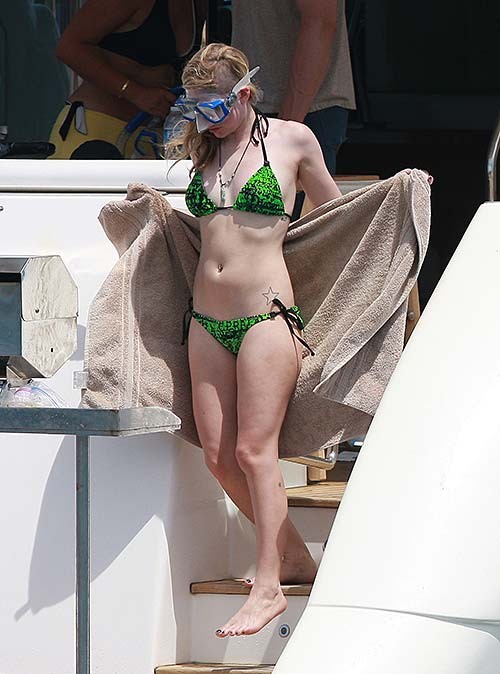 Avril Lavigne exposing sexy bikini body in green bikini on yacht #75255917