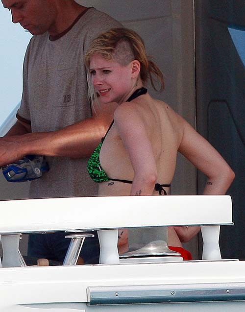 Avril Lavigne exposing sexy bikini body in green bikini on yacht #75255924
