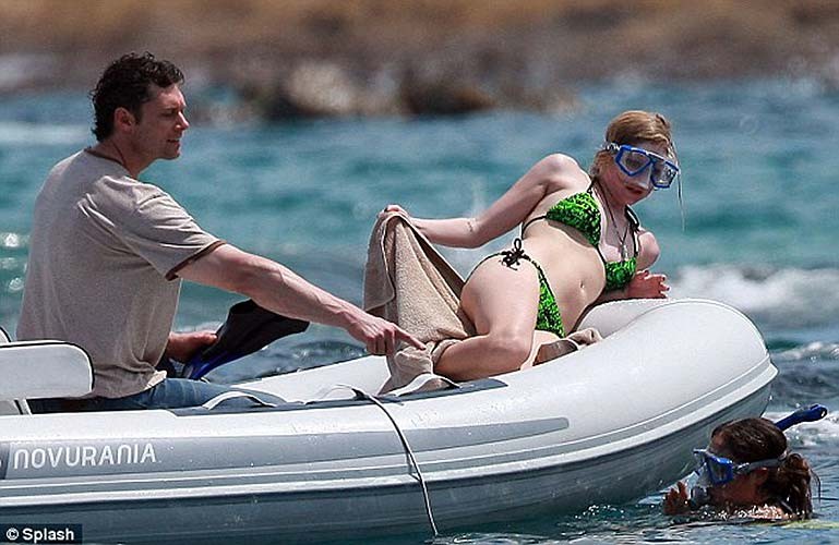 Avril Lavigne exposing sexy bikini body in green bikini on yacht #75255925