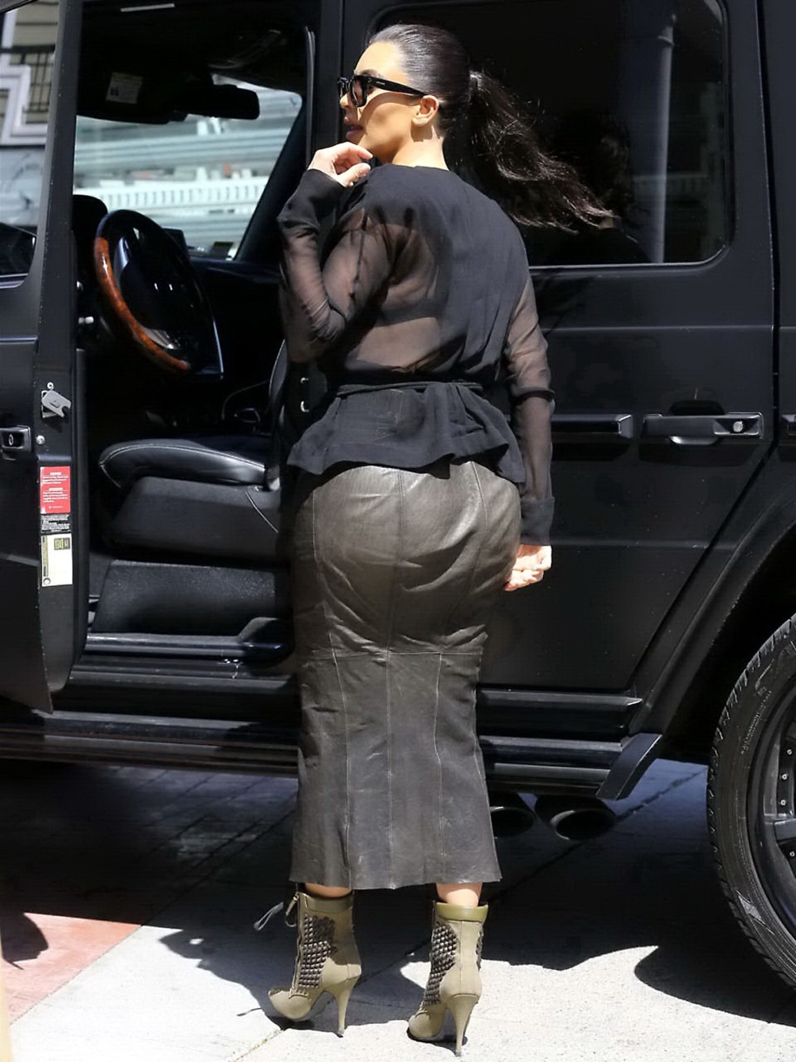 Kim Kardashian shows cleavage and booty while shopping at Canyon Beachwear #75197977
