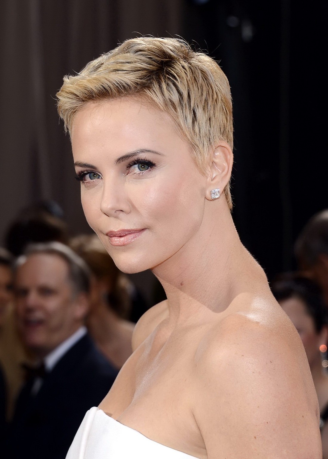 Charlize Theron looks very sexy wearing a strapless white dress at the 85th Annu #75240525