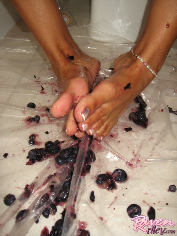 Raven smashes blueberries with her feet #70622757