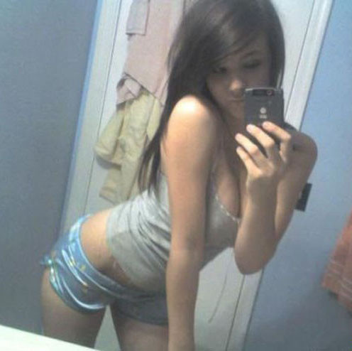 Cute girls with cell phones taking self photos #67110925