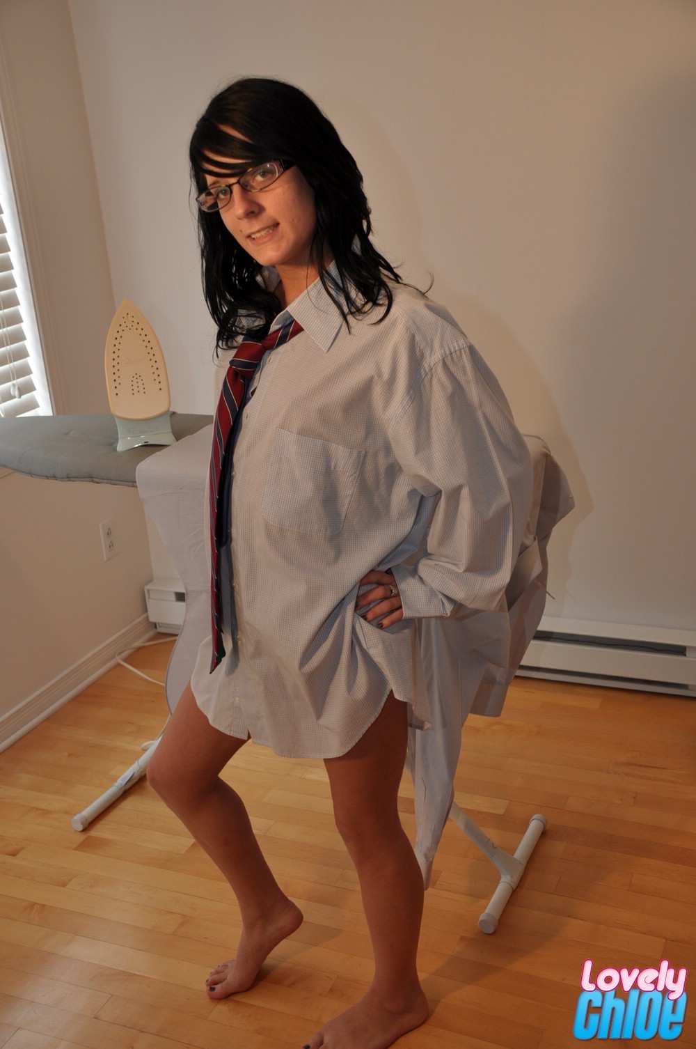 Skinny teen in glasses ironing #74687318