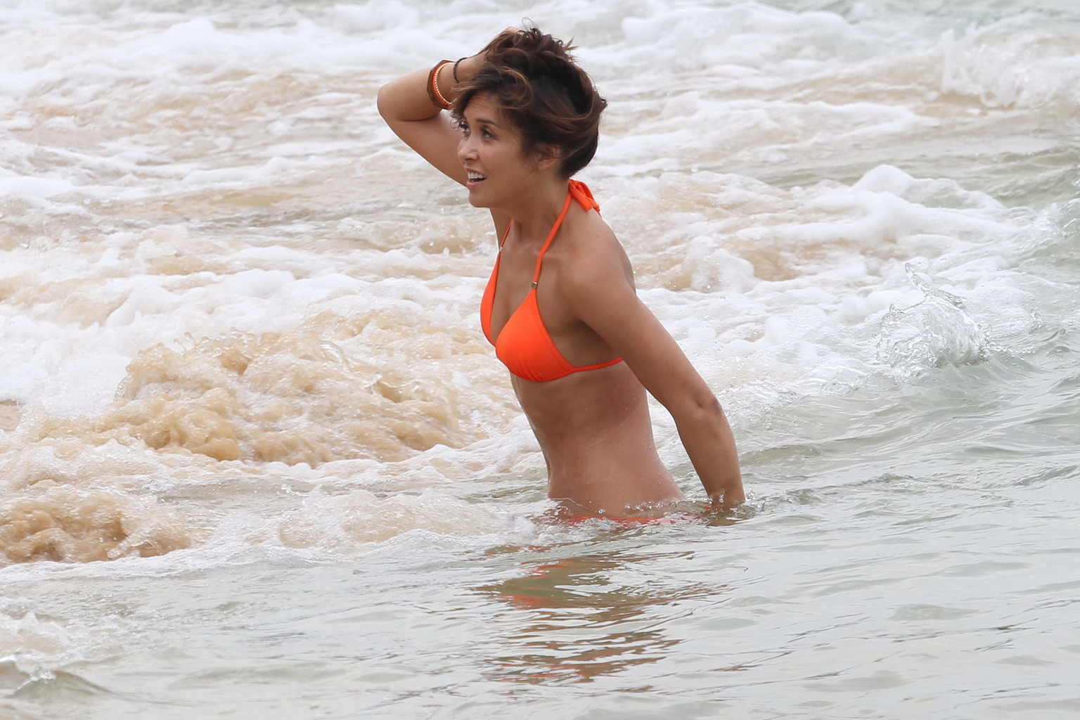 Myleene Klass wearing tiny orange bikini during a photoshoot at the beach in Tha #75236853