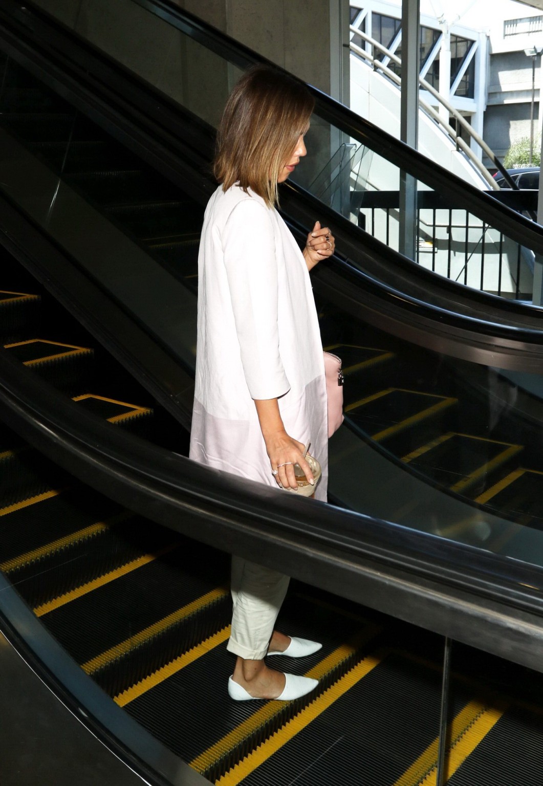 Jessica Alba cleavy wearing a low cut top at LAX Airport #75164957